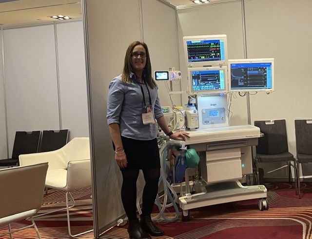 Emily Leckie with anaesthetic and patient monitoring equipment at a healthcare industry event